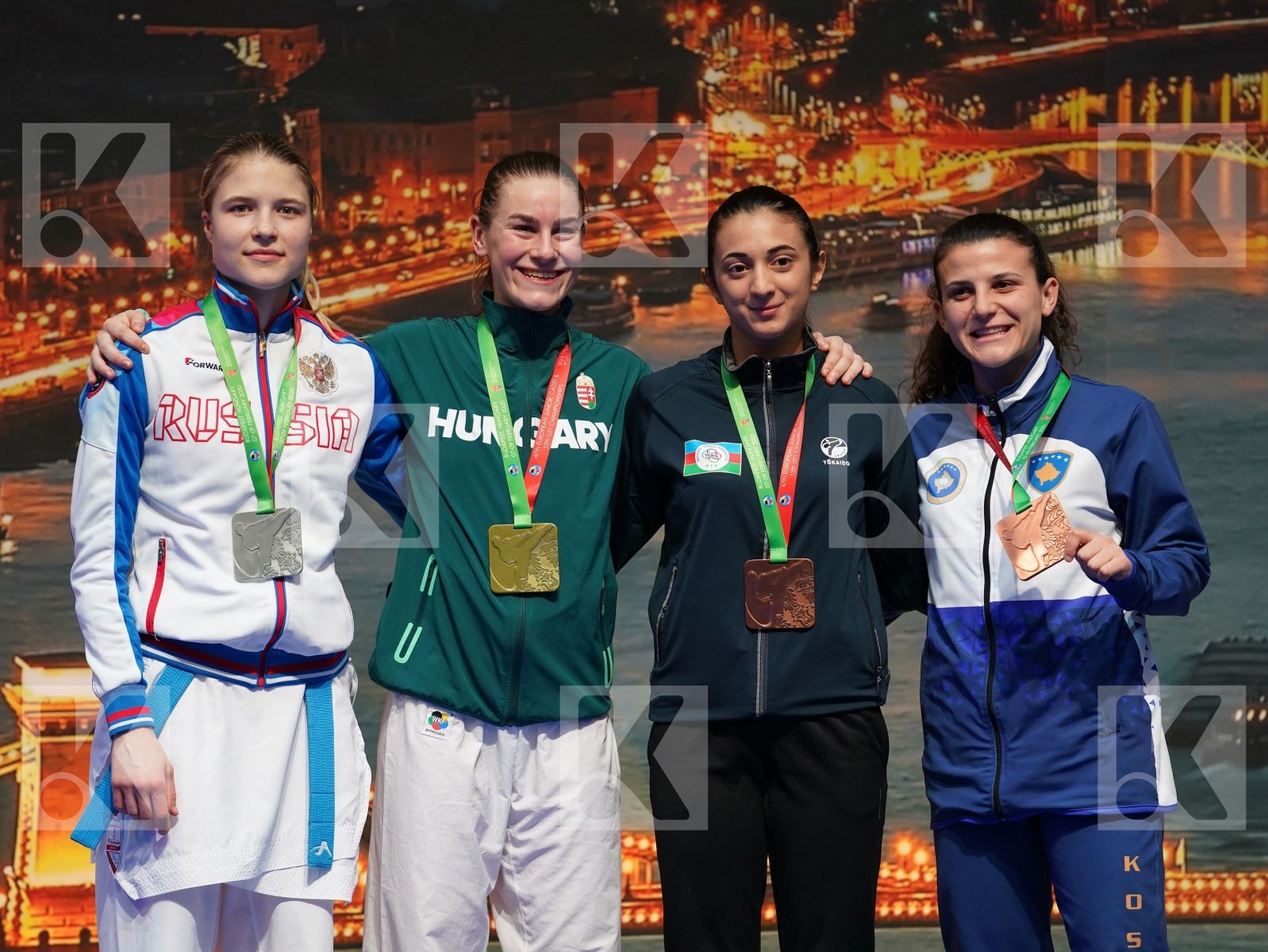 BARANYI ZSOFIA (HUNGARY), CHERNYSHEVA ANNA (RUSSIAN FEDERATION), SADIGOVA MADINA (AZERBAIJAN), GERVALLA ALBULENA (KOSOVO) in Under 21 Kumite Female -55 Kg - Podium ceremony