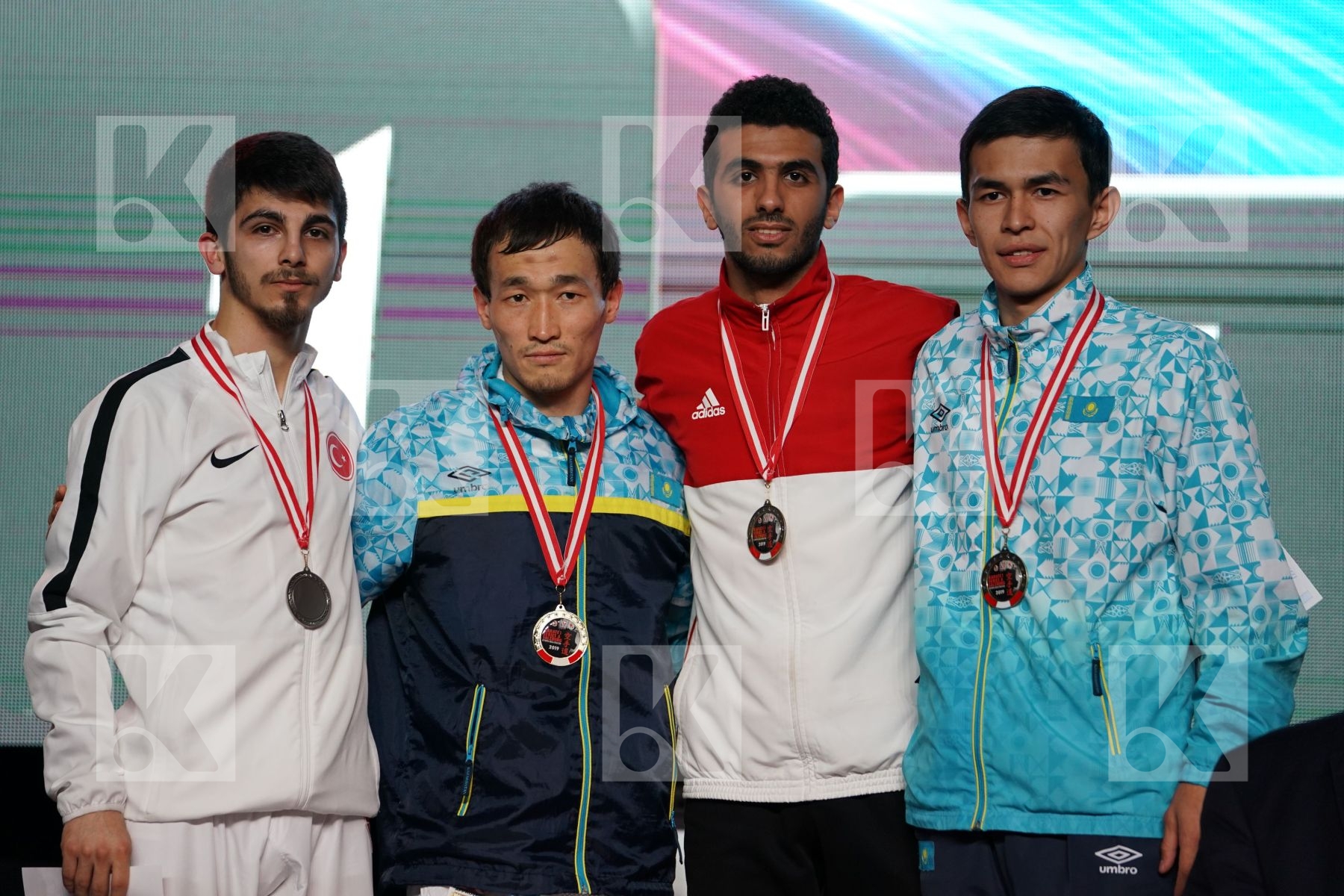 ERAY SAMDAN (TURKEY), DARKHAN ASSADILOV (KAZAKHSTAN), MALEK SALAMA (EGYPT), KAISAR ALPYSBAY (KAZAKHSTAN) in Senior Kumite -60 Kg - podium ceremony