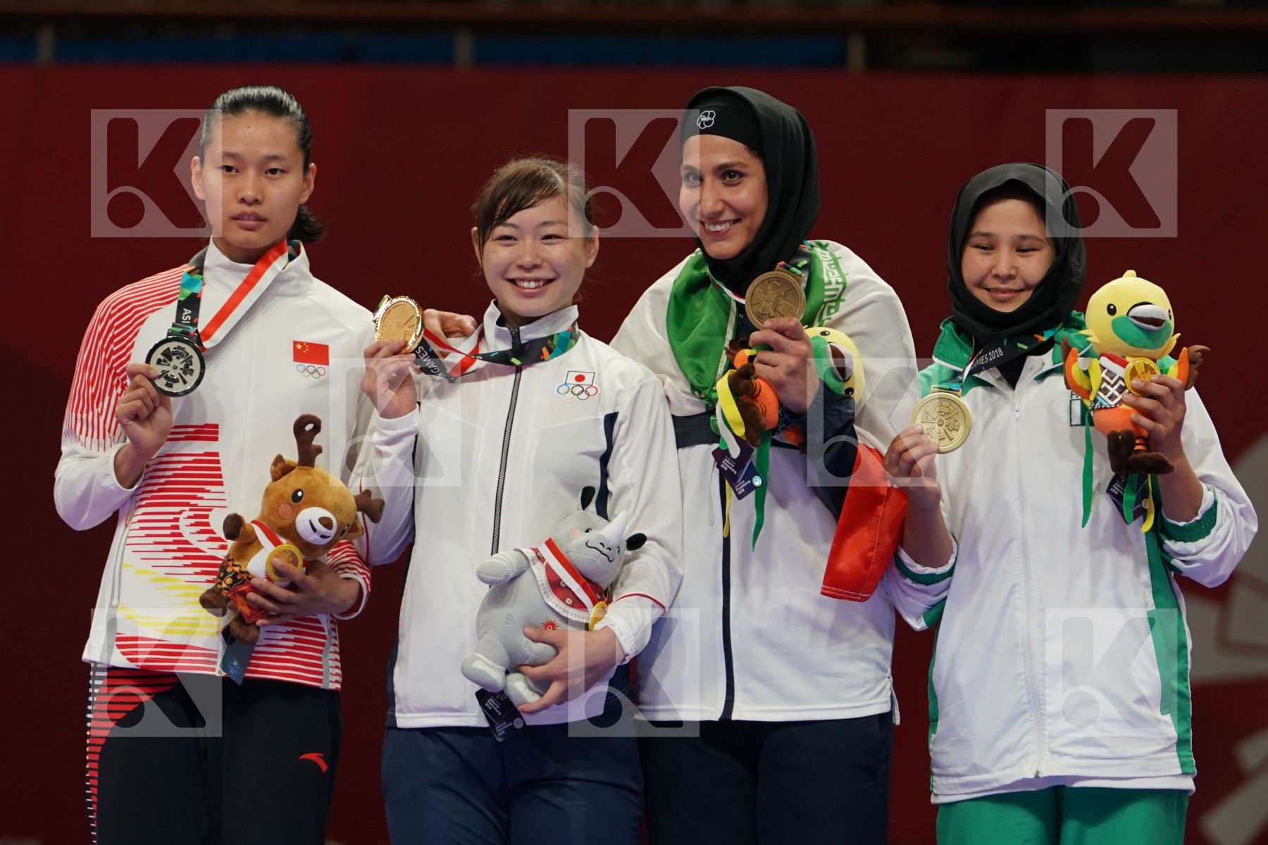 MENGMENG GAO (CHINA), AYUMI UEKUSA (JAPAN), HAMIDEH ABBASALI (ISLAMIC REPUBLIC OF IRAN), NARGIS (PAKISTAN) in Senior Kumite 68+ Kg - podium ceremony