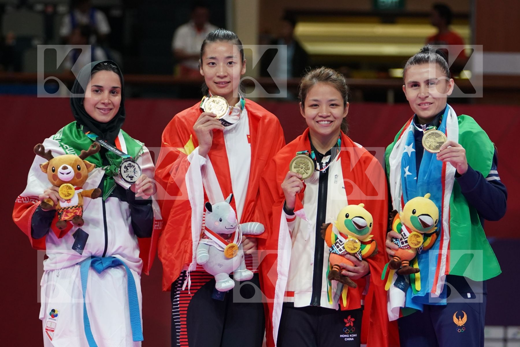 ROZITA ALIPOURKESHKA (ISLAMIC REPUBLIC OF IRAN), XIAOYAN YIN (CHINA), WAN YU CHOI (HONG KONG), IKBOLJON UZAKOV (UZBEKISTAN) in Senior Kumite Ð 61 Kg - podium ceremony
