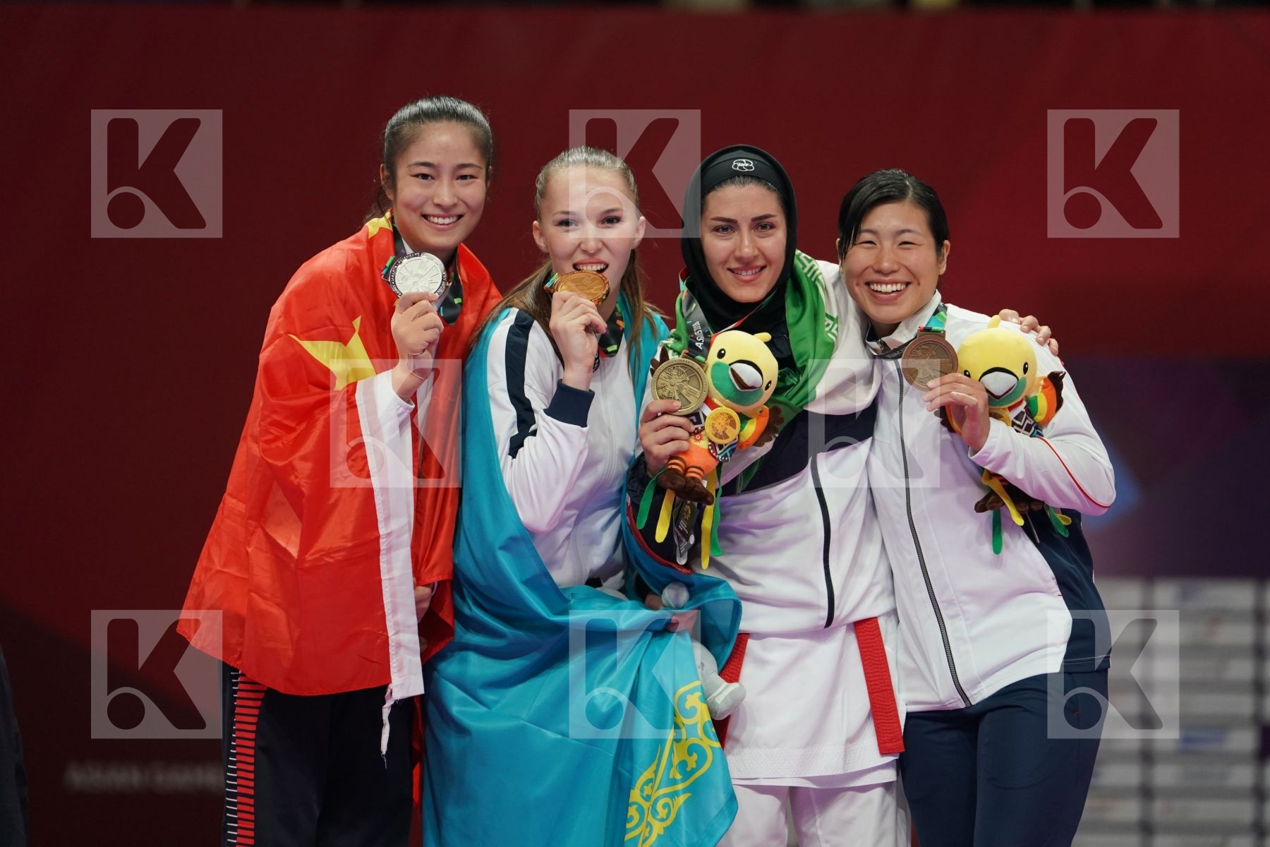 LINGLING TANG (CHINA), GUZALIYA GAFUROVA (KAZAKHSTAN), PEGAH ZANGENEHKARKOOTI (ISLAMIC REPUBLIC OF IRAN), KAYO SOMEYA (JAPAN) in Senior Kumite Ð 68 Kg - podium ceremony
