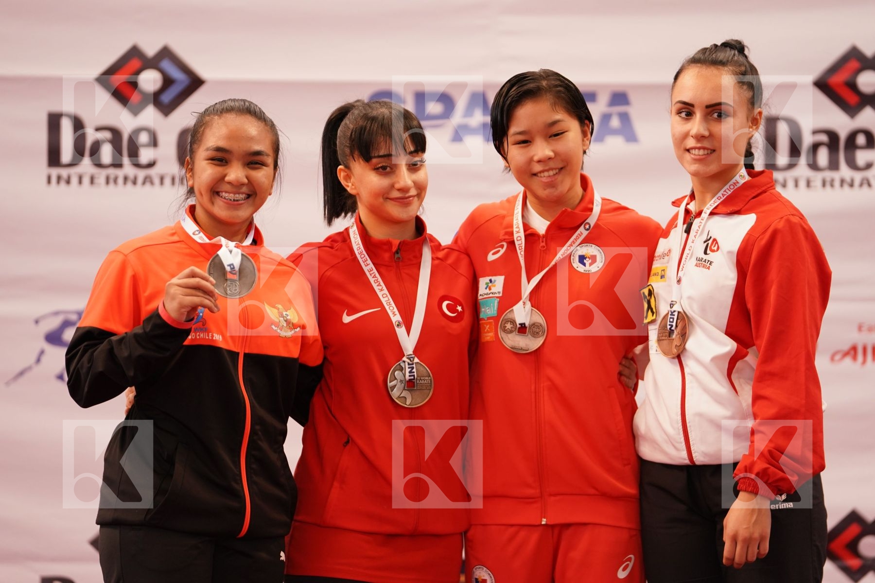 YILMAZ AYSE (TURKEY), MARZELLA SEKAR DAMAYANTI (INDONESIA), ALFORTE SAKURA (PHILIPPINES), CELO FUNDA (AUSTRIA) in Junior Kata Female - Podium ceremony